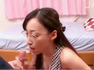 Glasses-wearing Japanese babe gets facialized indoors for filthy fun