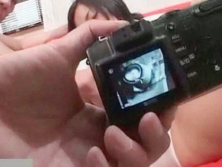 Fucking a hot and horny cutie's tight beaver with fingers in Tokyo and exploring her inviting nipples.