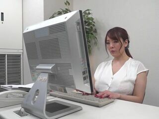 Hitomi Tanaka's massive titties take center stage in her slutty office lady outfit, demanding your undivided attention